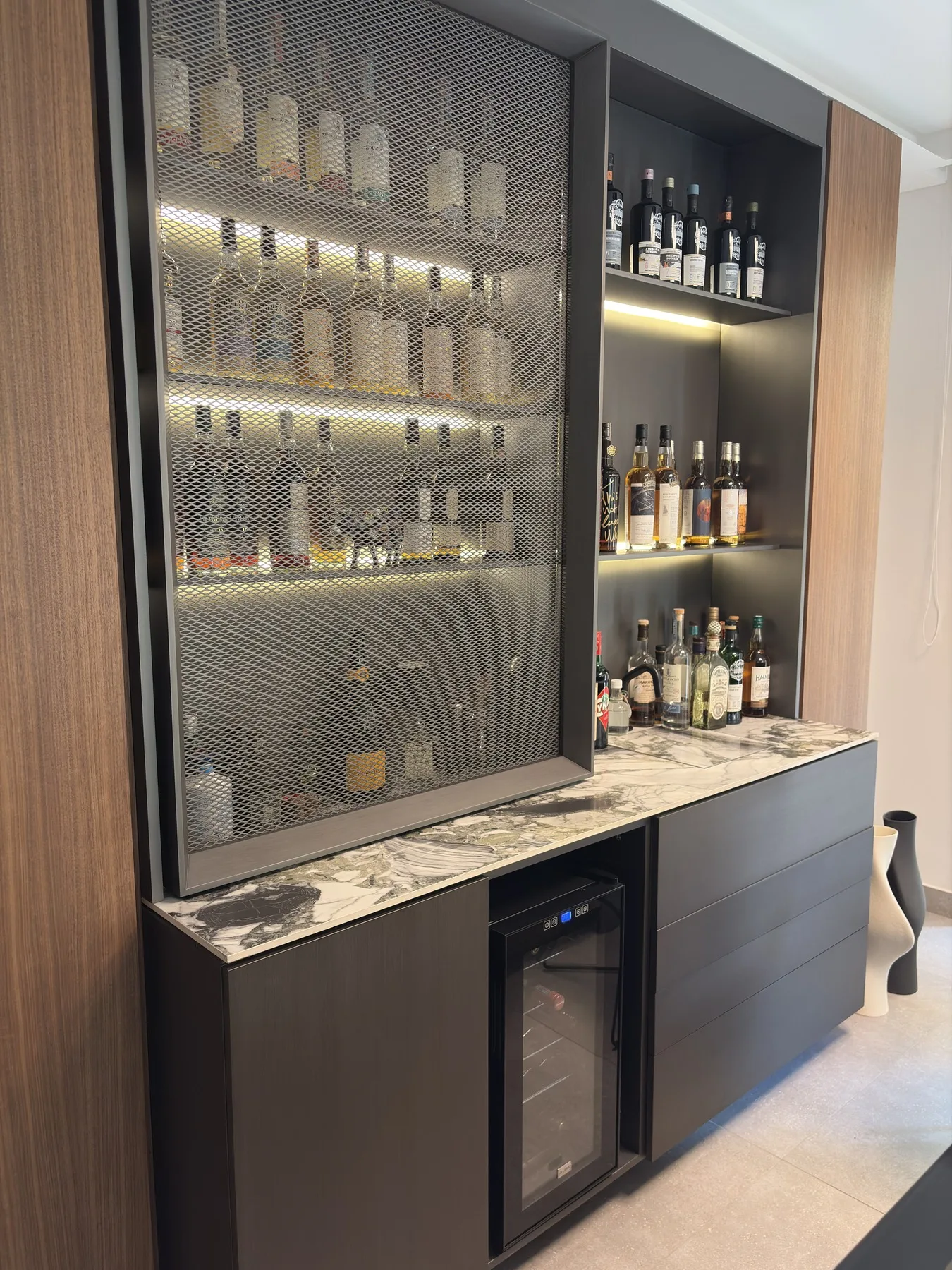 Home bar detail — marble counter and lit display