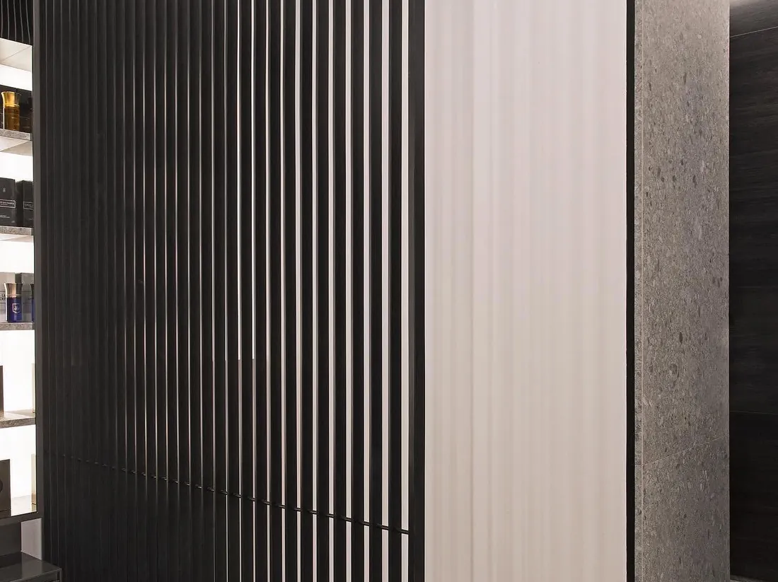 Black slatted screen and fluted panel detail