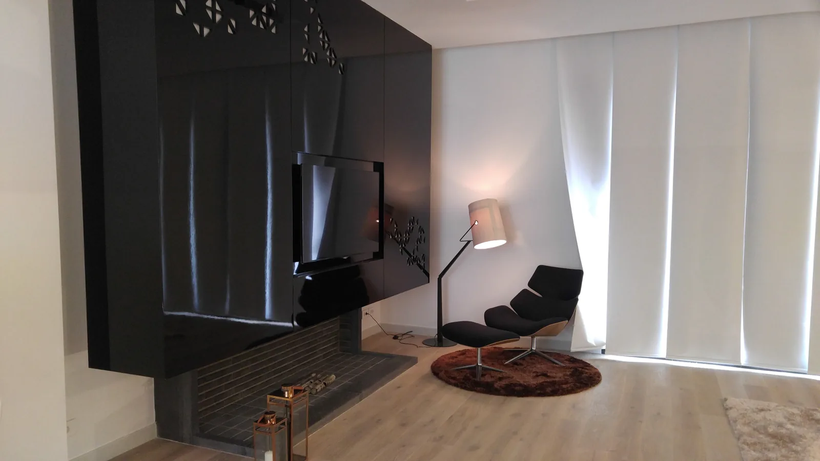 Tilal Faqra — fireplace and media wall in high-gloss lacquer